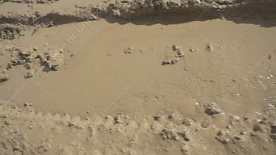 Goes through the mud on an armored personnel carrier. Dirt flies under the wheels