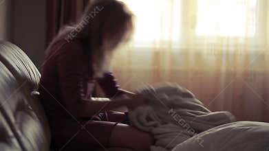 Depressed woman in bed. girl crying on the couch. acute mountain