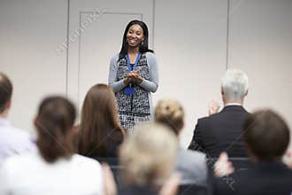 Audience Applauding Speaker After Conference Presentation