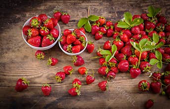Fresh red strawberry on wood background