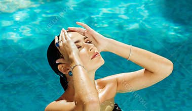 Girl with blue eyes swimming in the ocean, sea