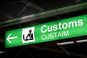 Customs sign in Airport and direction arrow