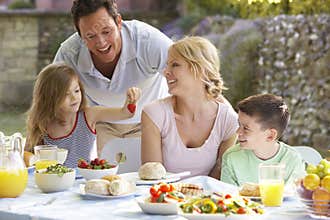 Family Eating An Al Fresco Meal