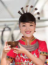 Hmong girl on her wedding dress present you wine