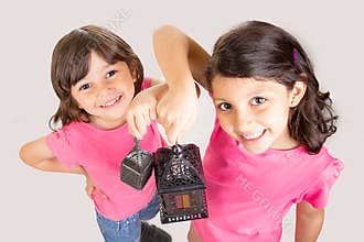 2 Cute Happy young girls celebrating Ramadan with their lantern