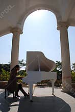 Playing piano in garden