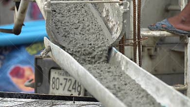 Non identify Construction workers pour concrete mix