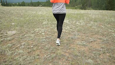 Young Athletic Woman Running on Mountain Trail. POV Follow Cam. Sunset Workout in Nature. Slow Motion