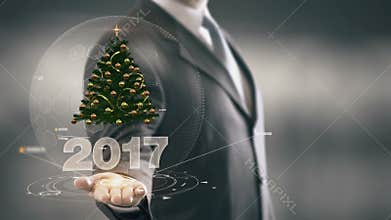 2017 Christmas tree Businessman Holding in Hand New technologies
