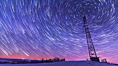 Traces of stars against the night sky, shot long exposure.