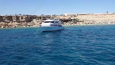 Yacht on the anchor swaying in the bay of Red sea
