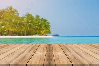 Wooden board empty table in front of blue sea & sky background.