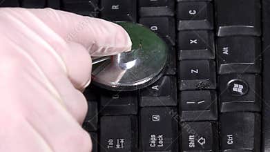 Keyboard examination with stethoscope on keyboard. Pc diagnostics
