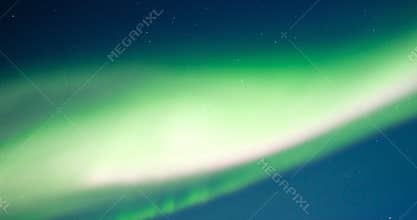 Northern Lights, polar light or Aurora Borealis in the night sky over Senja island in Northern Norway