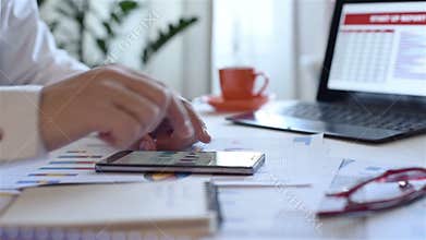 Stock Trader Looking At Mobile Phone