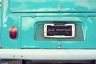 Just married sign on aquamarine classic vintage van