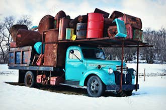 Vintage Teal Truck Holding Junk