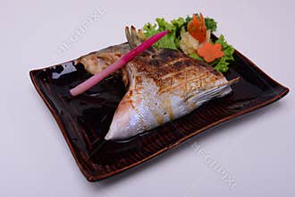 Buri-Kama Shioyaki ,Broiled Yellowtail Collar Shio-Yaki , Traditional Japanese food isolated on white background