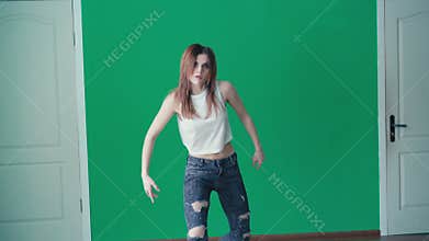 Young pretty girl dancing hip-hop in dance studio in 4K