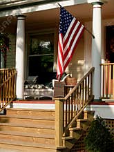 American flag on porch.