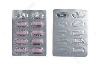 Top view of pink capsules in blister pack isolated on white