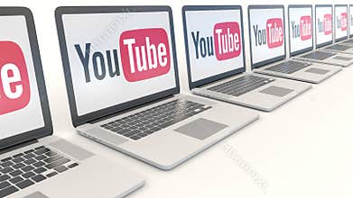 Modern laptops with YouTube logo. Computer technology conceptual editorial 4K clip, seamless loop