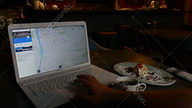 Browsing photo of Prague in Google - man using Laptop planning travel