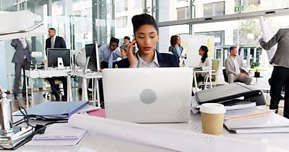 Time-lapse of businesswoman having coffee while working at desk