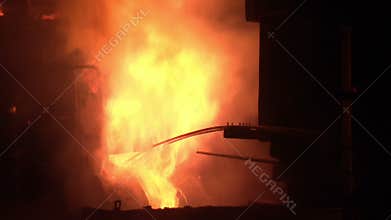 Industrial furnace fire. Metal furnace fire. Smelting metal in furnace
