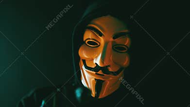 Anonymous computer hacker wearing Guy Fawkes vendetta mask