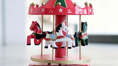 Music box horse white merry go round red carousel horses toy closeup