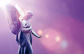 Angel in heaven over purple sky background