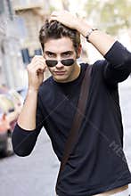 Cool fashion model man plain t-shirt sunglasses