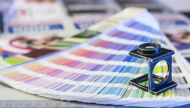Printing process with magnifying glass and color swatches
