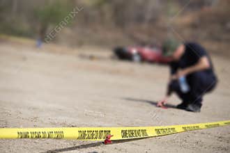 Police line do no cross with blurred law enforcement background