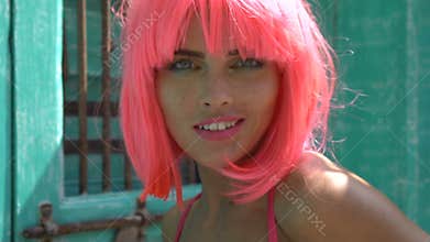 Woman in pink lingerie and wig