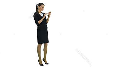Pretty businesswoman laughing at something funny on her smartphone on white background