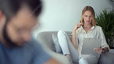 Diligent female student doing homework at home