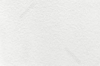 Texture of old light white paper background, closeup. Structure of dense cream cardboard