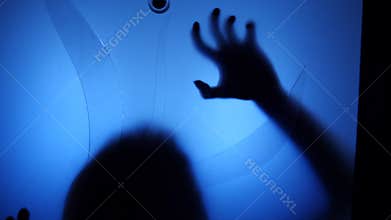 A ghost girl in the house. The spirit of a little girl. Scary scene of a terrible woman. The zombie knocks at the