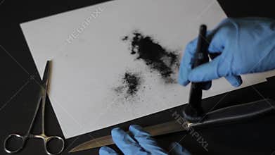 Dusting a knife for prints hd
