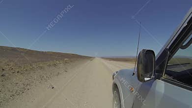 4x4 car driving on a dirt road