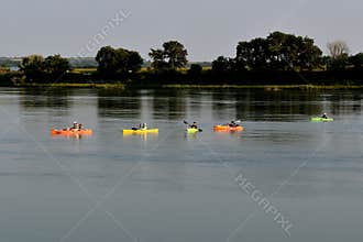 Kayaks paddling to shore on Missouri River