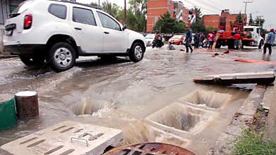 Municipal workers deplete the sewers during the flood.