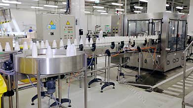 Beverage industry manufacturing line. Milk bottles on conveyor belt