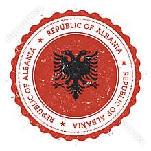 Grunge rubber stamp with Albania flag.