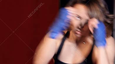 Close up of the woman with boxing handwraps trainig.