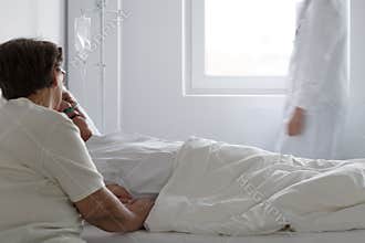 Elderly couple and doctor