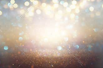 glitter vintage lights background. light silver and gold. defocused