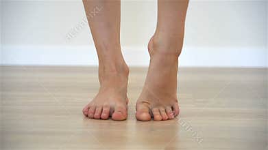 Girl gymnast doing warm up for legs